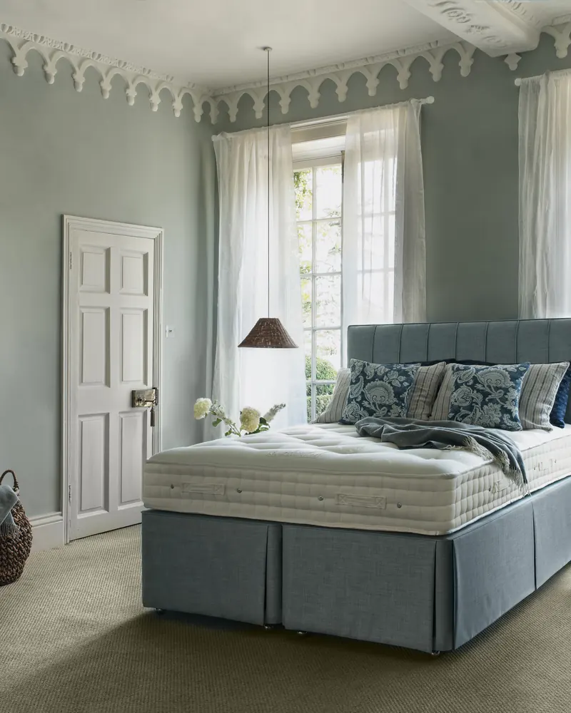 Hypnos Legacy bed dressed in a bedroom