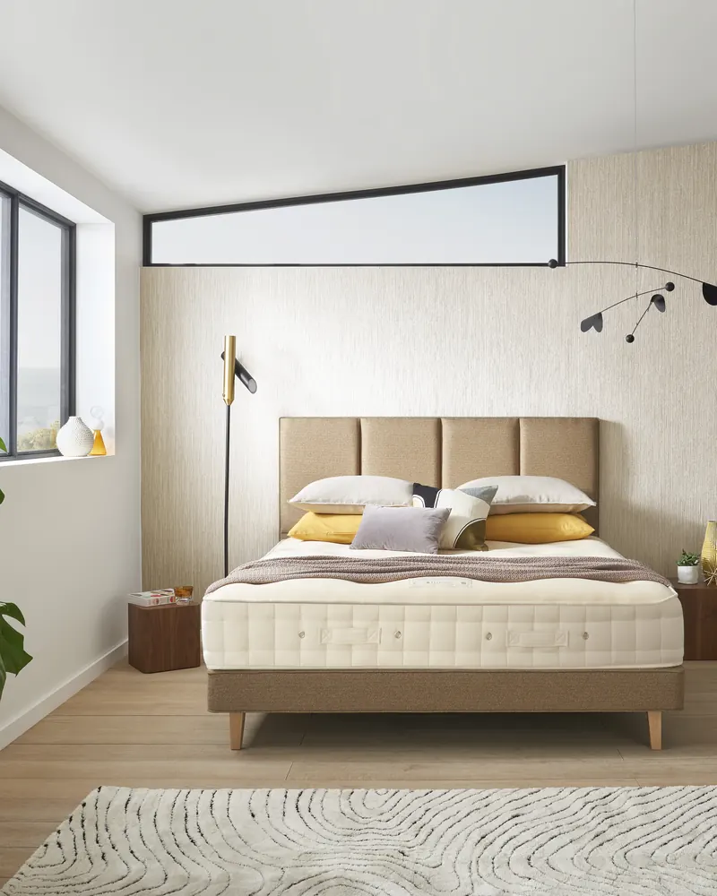 Hypnos Luxury No Turn bed dressed in a bedroom